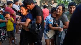 Relatives of Jose Perez mourn as police recover his body from a ravine where he was found shot in Trujillo, Peru, Friday, May 30, 2026. (AP Photo/Rodrigo Abd)