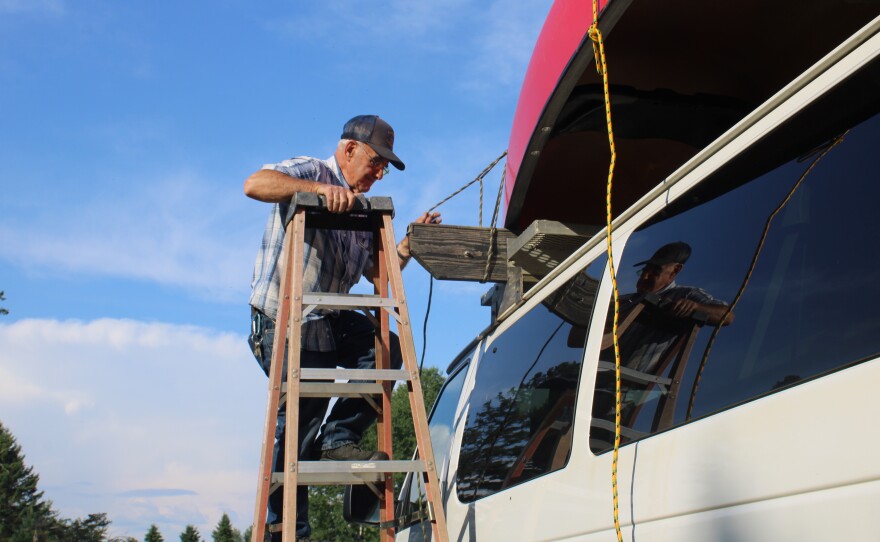 Norm L'Italien tying down a canoe on Sunday, June 28th, 2026. 