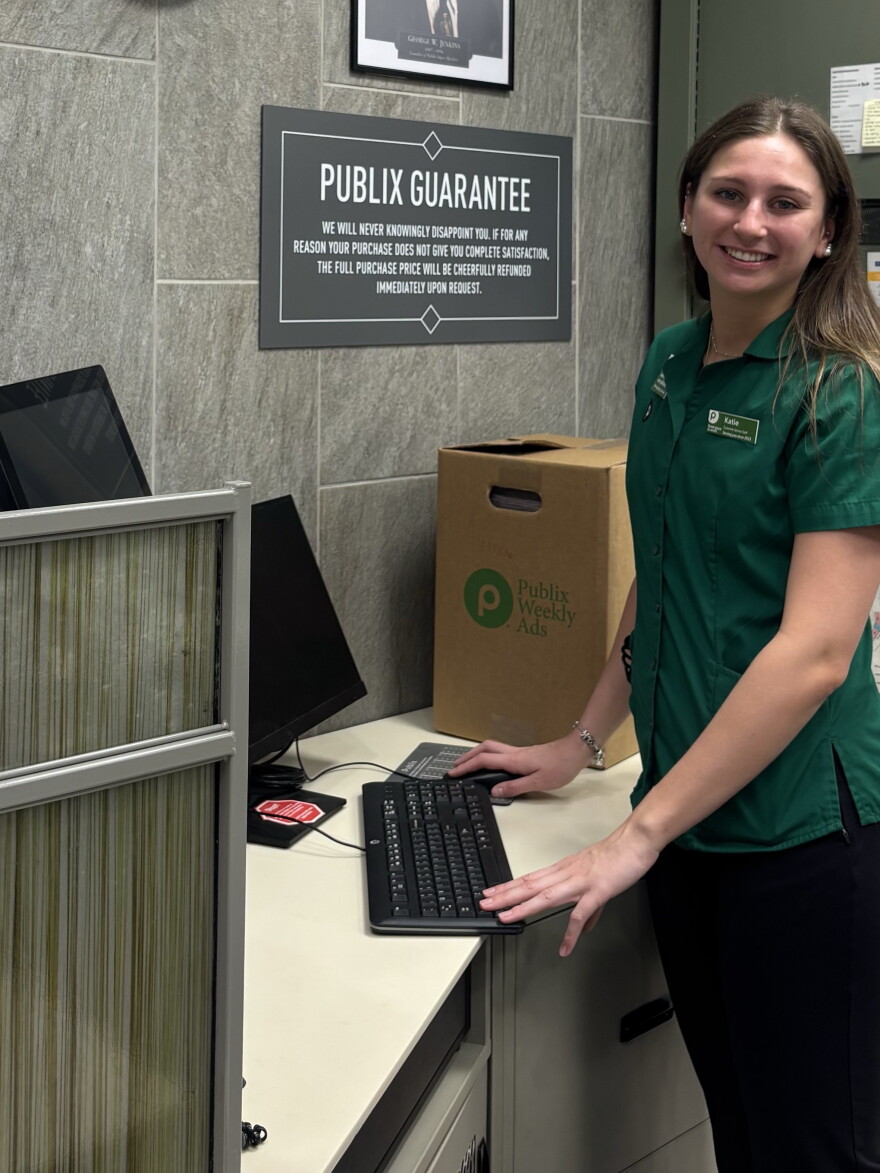 UF senior Katie Curry works at the customer service desk at Publix while attending the University of Florida.