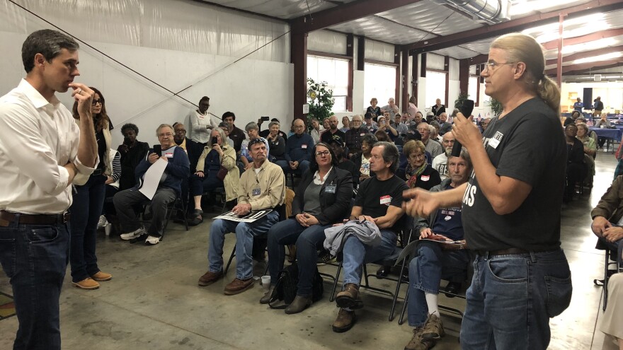 Rep. Beto O'Rourke, the Texas Democrat challenging Sen. Ted Cruz's re-election bid this year, speaks to voter Mike Nichols at an event in Pittsburg, Texas. More than 100 people showed up to the event, in a town of just over 4,700.