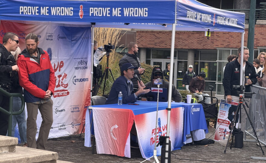 Alex Stein, a conservative YouTube personality debates with students and protesters at the Turning Point USA event in the EMU Amphitheater at the University of Oregon, Oct. 28, 2026.