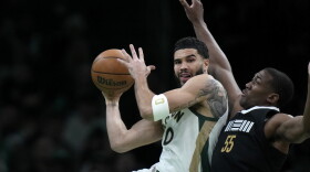 Boston Celtics forward Jayson Tatum (0) looks to shoot at the basket as Memphis Grizzlies center Trey Jemison (55) defends in the first half of an NBA basketball game, Sunday, Feb. 4, 2024, in Boston. (AP Photo/Steven Senne)