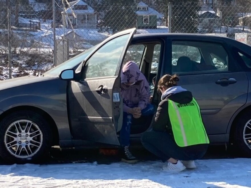 A volunteer surveys a participant in the Annual Point in Time Count in February 2022. The count is an annual U.S. Department of Housing and Urban Development census of people experiencing homelessness carried out by local governments.