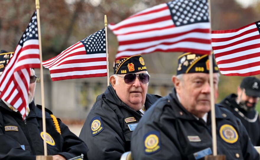 Flags fly on the American Legion of Plains float.
