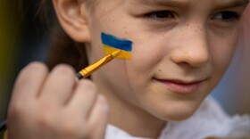<strong>March 20:</strong> Rachel Nockles, 7, gets a Ukrainian flag painted on her face at a STANDwithUKRAINE rally in front of the White House. Her mother is from Ukraine, but her family now lives in Bethesda, Maryland.