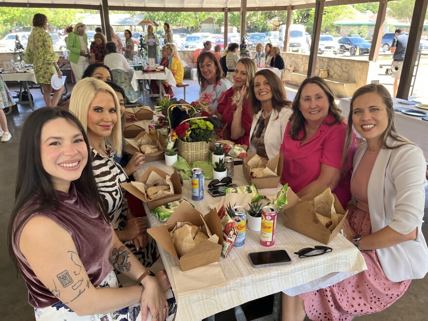 Third Annual Women's Picnic in the Park attendees seated at one of 10 fundraiser tables.