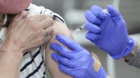A woman receives a COVID-19 vaccination in Sandy, Utah. (Rick Bowmer/AP)