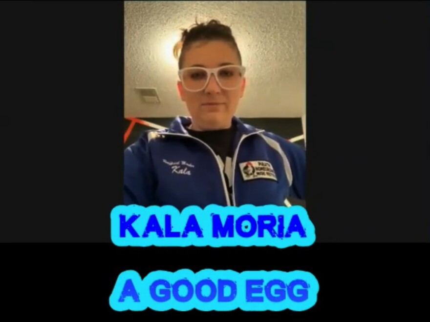 Screenshot of a woman on video with the caption Kala Moria, A Good Egg