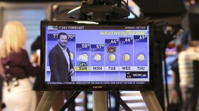 Dale Earnhardt Jr. delivers a surprise seven-day forecast at a Charlotte news station ahead of weekend NASCAR race in Martinsville to help launch Goodyear's new WeatherReady tire on Friday, Oct. 27, 2017, in Charlotte, N.C. (Jason Walle/AP Images for Goodyear)