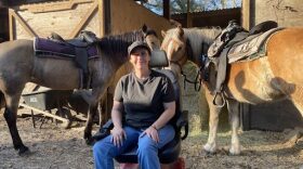 Tina Nichols, owner of Makin’ Tracks Trail Rides, with two of her 15 horses: Lexi (left) and Lilly (right). (Kaitlyn Wadulack/WUFT News).