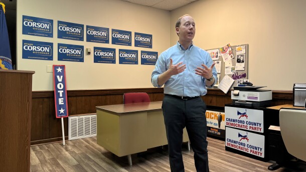 Ethan Corson speaks in the Crawford County Democrats' office. He's standing in front of a wall, which has his campaign signs on it.