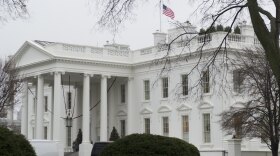 The U.S. flag flies at half-staff over the White House in Washington, D.C., in honor of former South African President Nelson Mandela.