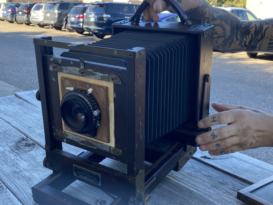 Holliday Tintype owner Matthew Nixson displays his 1920 Kodak camera after his interview on November 20, 2024.