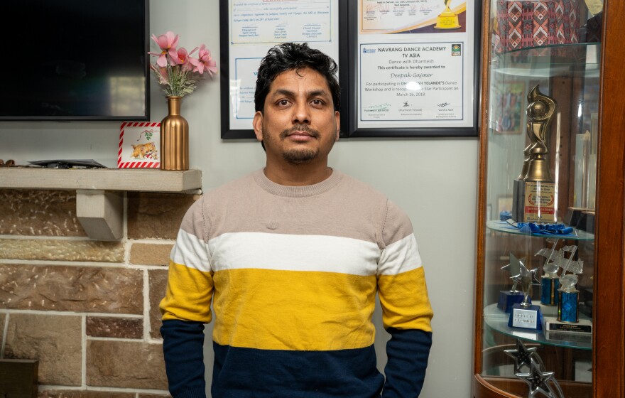 Man stands in living room.