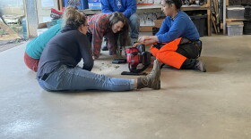 People learning how to use tools
