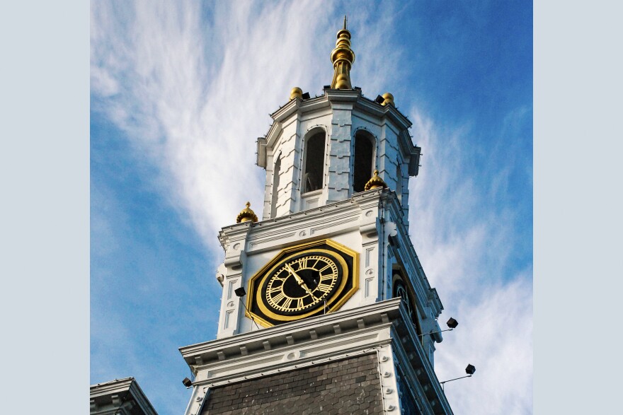 The clock and bell tower of Norwich City Hall are pictured. Peter Nystrom served three terms as the city's mayor.