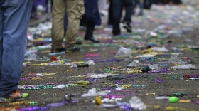 Mardi Gras beads strewn on a New Orleans street.