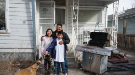 Gaspar Valencia, his children and his dog stand in front of the house they’ve lived in for eight years.