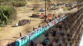 Migrants, mostly from Haiti, gather at a makeshift encampment under the International Bridge on the broder between Del Rio, TX and Acuña, MX on September 17, 2021 in Del Rio, Texas. (Jordan Vonderhaar/Getty Images)