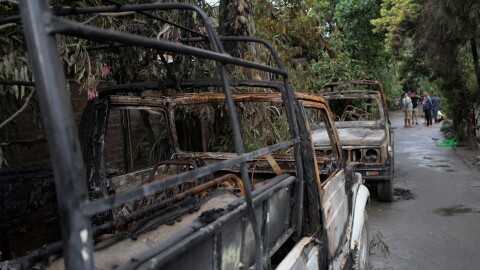 Burned remains of cars, which were torched by an angry mob during an attack in Imphal, Manipur.