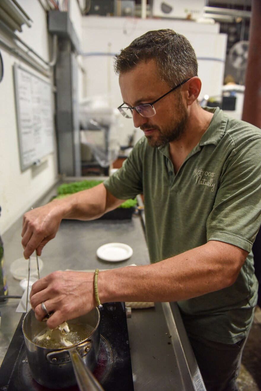 J.T. Gelineau(cq) cooks mushrooms by boiling them in water on Monday, July 17, 2023, at his test kitchen in O’Falllon, Mo. Gelineau applies his background as a renowned chef to cook plant-based meals with rich, savory flavor.