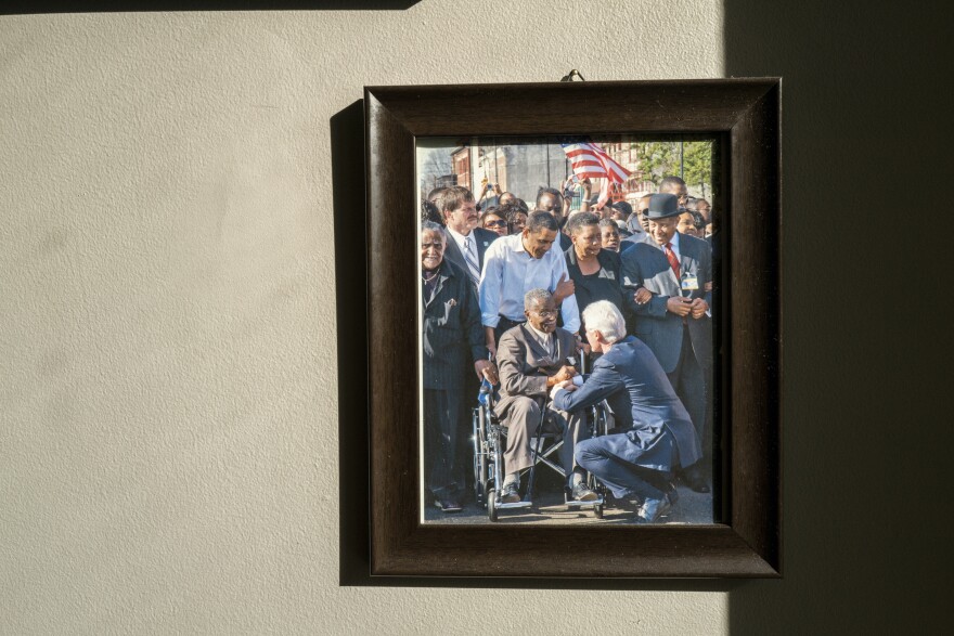 A photo of Barack Obama, Bill Clinton, Fred Shuttlesworth and JoAnne Bland hangs in Bland's home in Selma, Ala.