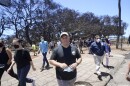 Gov. Josh Green walks away from the Lahaina historic banyan during a tour of wildfire damage on Saturday, Aug. 12, 2023, in Lahaina, Hawaii. (AP Photo/Rick Bowmer)