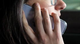 The proposed law states, "a person may not hold or use a telecommunications device in the driver's seat of a motor vehicle while the motor vehicle is in motion unless the device is used in conjunction with hands free or voice operated technology.
