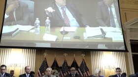 Former Attorney General Bill Barr is seen on a screen during a hearing held by the House Jan. 6 committee on Monday.