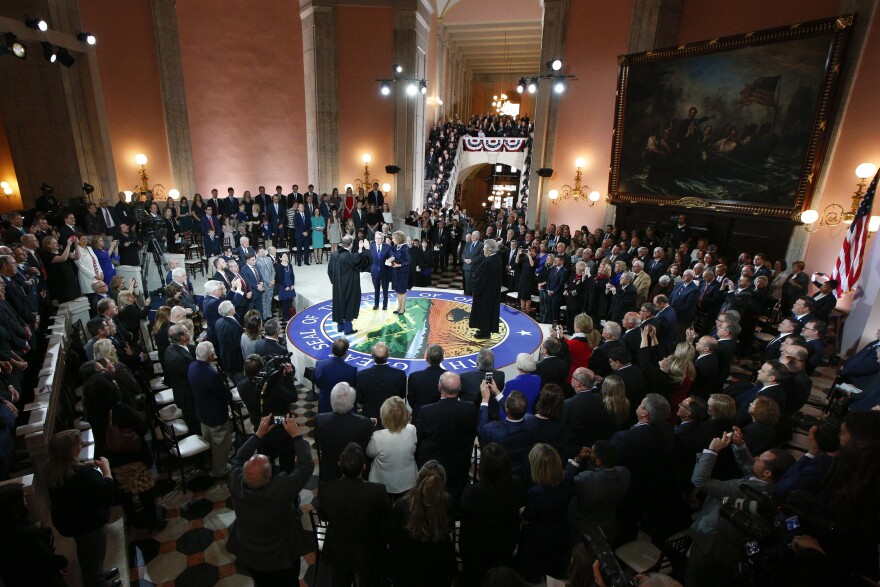 Supporters watch Gov. Mike DeWine take the oath of office.