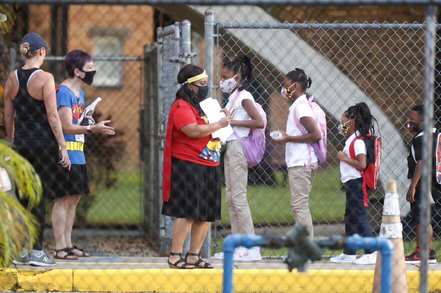 Students return to school at Seminole Heights Elementary School after the Florida Department of Education mandated that all schools must have in-class learning during the week on August 31, 2020 in Tampa, Florida.