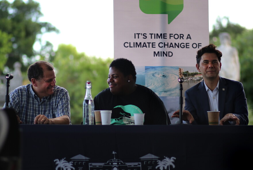 Ben Kirtman, left, director of the Climate and Environmental Hazards Program at the University of Miami, Valencia Gunder, center, a community activist, and Ken Russell, right, a City of Miami Commissioner, talk about Climate Gentrification. 