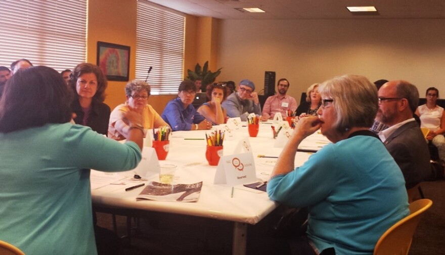 Felicia Shaw sits at the head of the table in one of five meetings with organizations that receive RAC funding. 