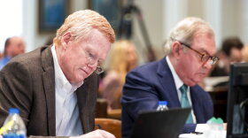 Alex Murdaugh, left, jots down notes during his double murder trial at the Colleton County Courthouse in Walterboro, S.C., on Monday, Feb. 6, 2023. (Jeff Blake/The State via AP, Pool)