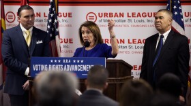 Michael McMillan, left, president of the Urban League of Metropolitan St. Louis, and Rep. Lacy Clay listen as U.S. House Speaker Nancy Pelosi talks about the importance of voting rights at the Ferguson Community Empowerment Center on Monday.