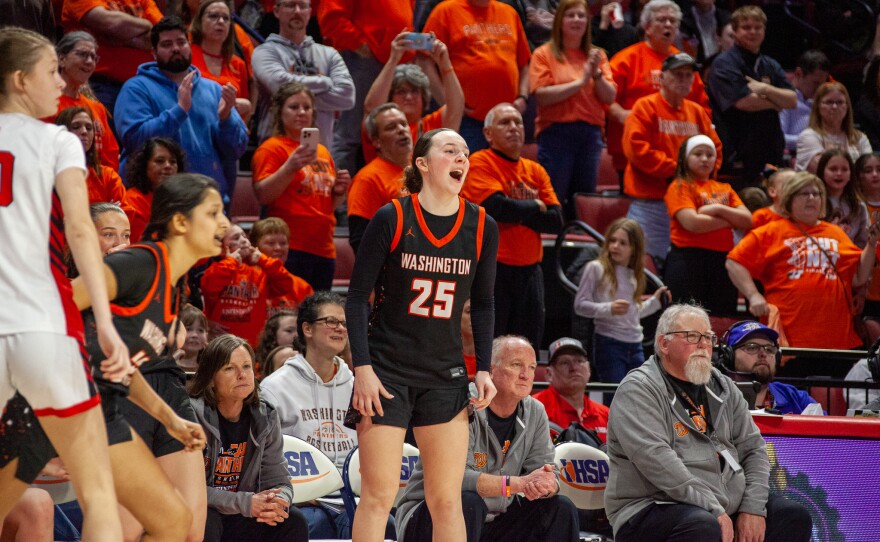 Girls high school basketball players inside an arena