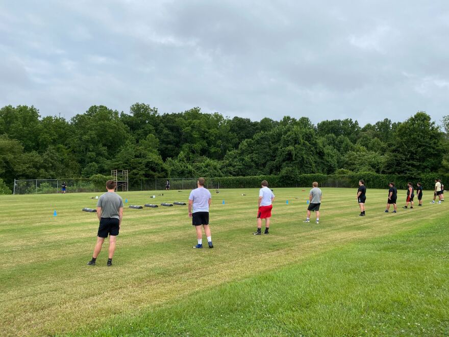 Lake Norman High School football players line up for sprints during Thursday's socially distanced practice