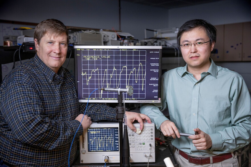 Missouri S&T professors Rex E. Gerald II and Jie Huang with the sensor they are developing that could help screen people for viruses like coronavirus.