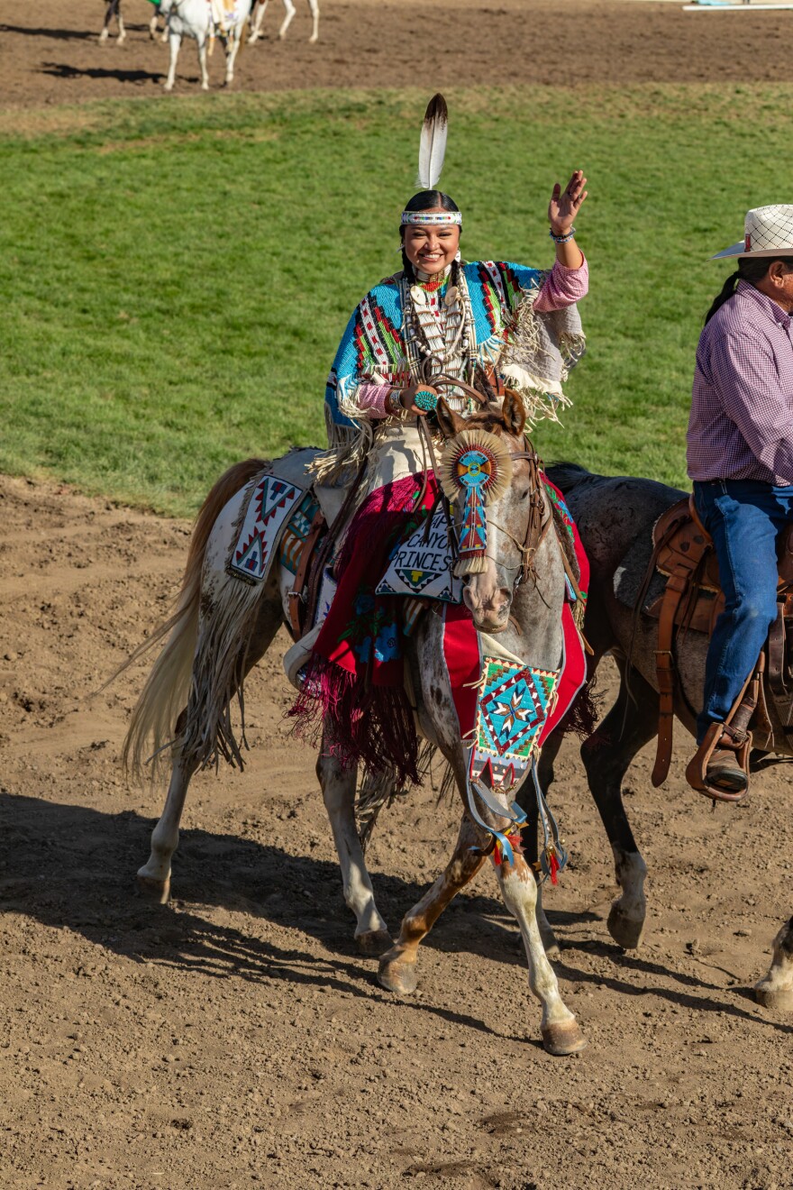 Lauren Gould, Happy Canyon Princess of the Pendleton Round-Up 2024, waving to the rodeo crowd.
