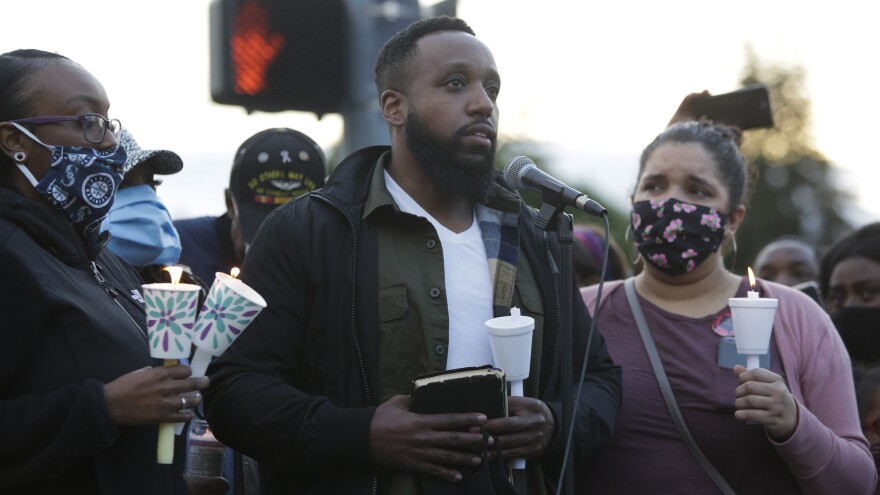 Matthew Ellis speaks at a vigil at the intersection where his brother, Manuel Ellis, a 33-year-old black man, died in police custody in Tacoma, Wash. Ellis's death was ruled a homicide this week by the Pierce County Medical Examiners Office.