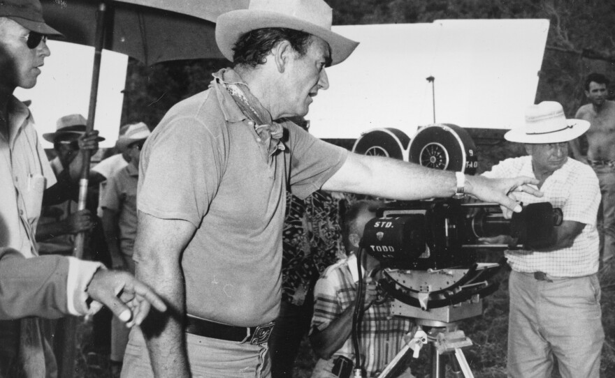 6-foot-4 actor John Wayne directs a scene for the Hollywood movie <em>The Alamo</em> in 1959. Wayne also portrays the reportedly 6-foot-tall Davy Crockett in the movie.