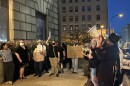 Protesters chant and hold signs calling for justice for Jazmir Tucker, a 15-year-old fatally shot by an Akron police officer last year, outside of city hall on Oct. 6, 2025.