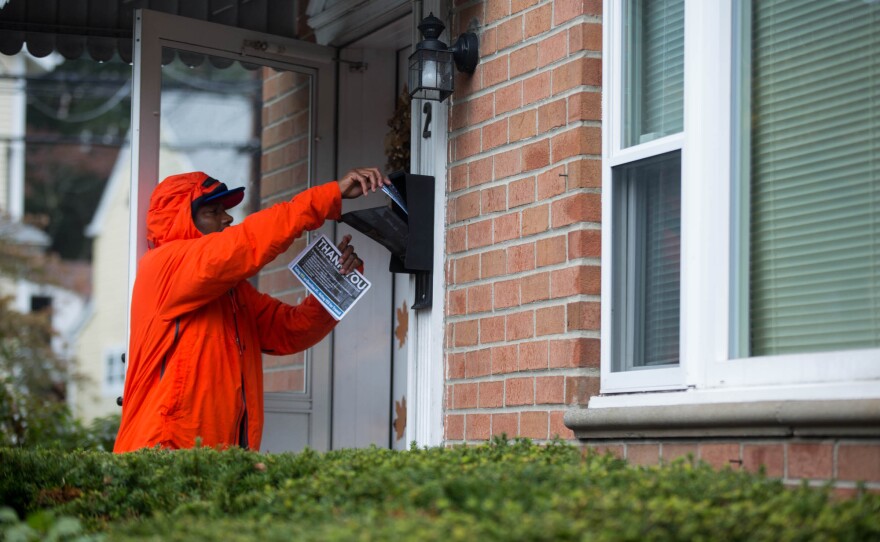 A member the Stamford branch of the Amalgamated Transit Union leaves a pamphlet behind at a residence in Glenbrook section of town as part of an effort by ATU workers on October 28, 2018 to spread the word about the lockbox ballot question.