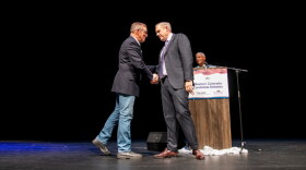 U.S. Rep. Jeff Hurd, incumbent candidate for Colorado's 3rd Congressional District (right), shakes hands with challenger Dwayne Romero after their debate at a Club 20 at the Asteria Theater in Grand Junction. Sept. 19, 2026. (William Woody for CPR News)