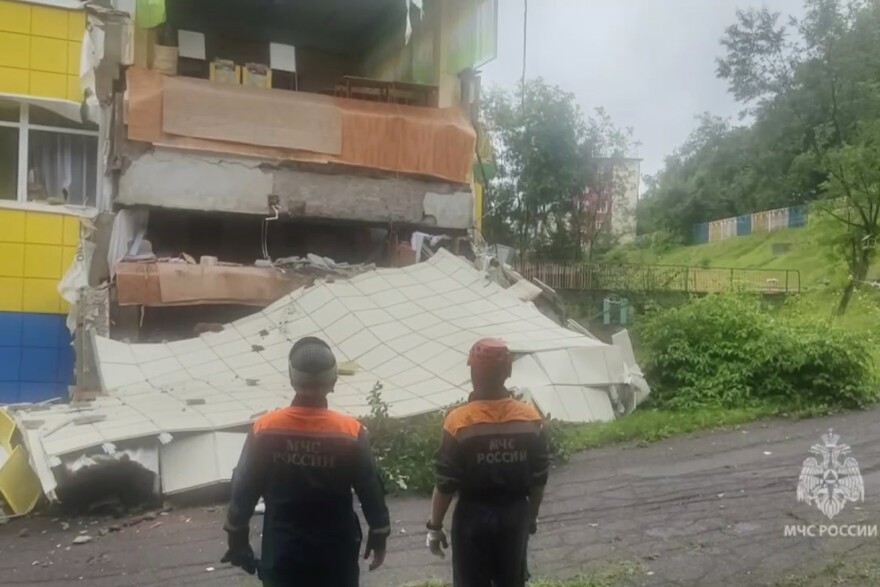 In this image taken from a video released by the Russian Emergency Ministry Press Service, rescuers inspect a kindergarten damaged by an earthquake in Petropavlovsk-Kamchatsky, Russia, Wednesday, July 30, 2025.