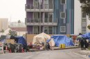 Tents are set up along a freeway in a homeless encampment, May 12, 2025, in Los Angeles.