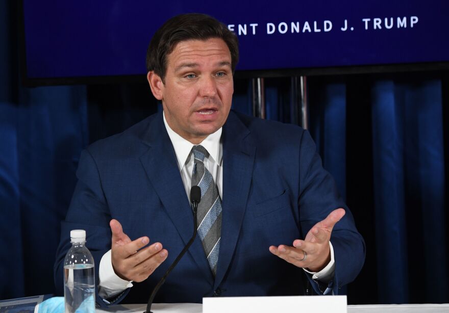 Florida Gov. Ron DeSantis, seen here in July, has extended the voter registration deadline by a day after the state's online portal crashed Monday.