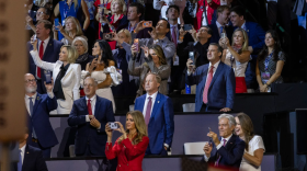 Texas Attorney General Ken Paxton, the state's GOP nominee for U.S. Senate, listens as President Donald Trump addresses the Republican midterm convention crowd in Dallas on Thursday, Sept. 10, 2026.