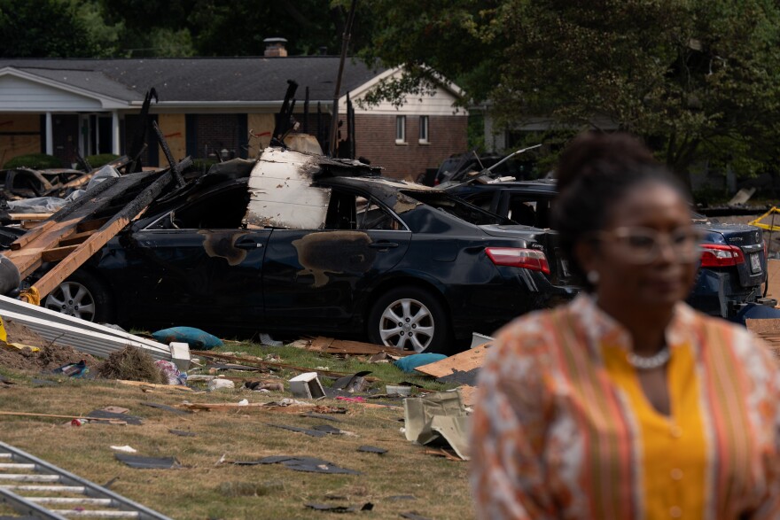 St. Louis County officials hold a press conference in front of a row of homes that exploded on Monday, Aug. 25, 2025, near Black Jack. The blasts damaged at least 20 surrounding residences.