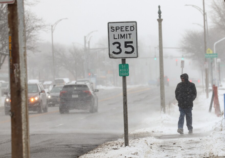 Traffic moves along Monroe Avenue in Brighton, N.Y., where the state Department of Transportation has proposed a resurfacing project that would reconfigure much of the corridor, add improved crosswalks, and potentially lower the speed limit to improve safety for drivers, pedestrians and cyclists.